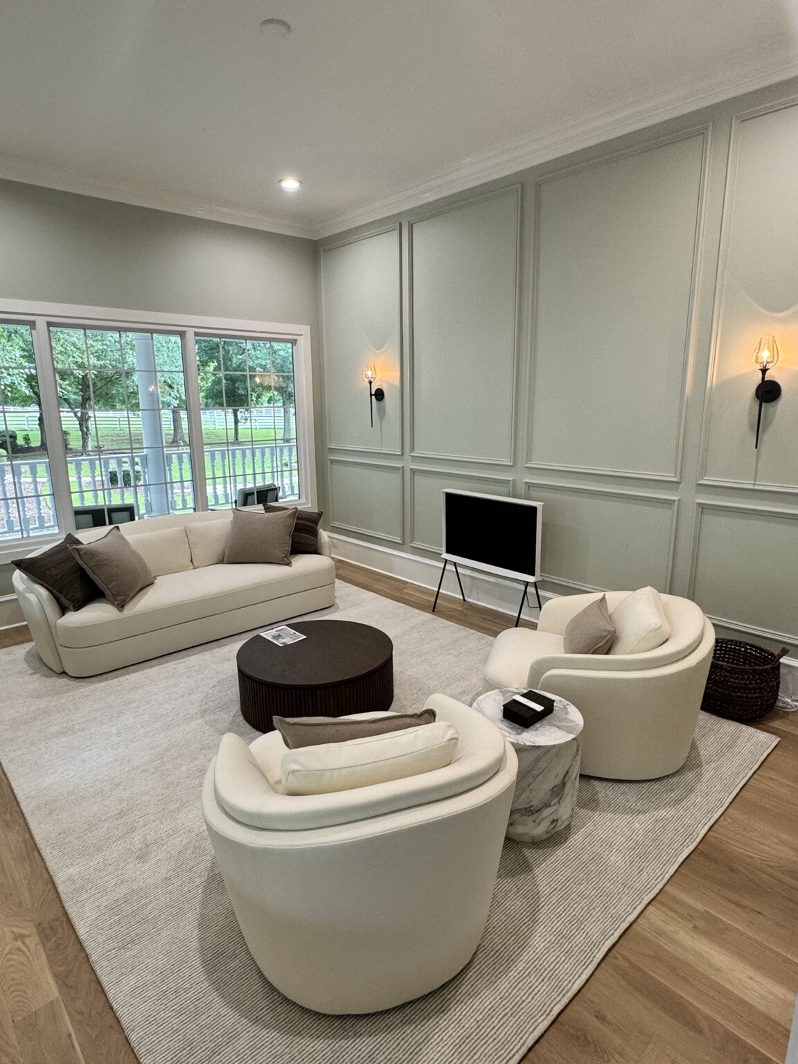 Sitting room after renovation with panelled walls and contemporary furniture