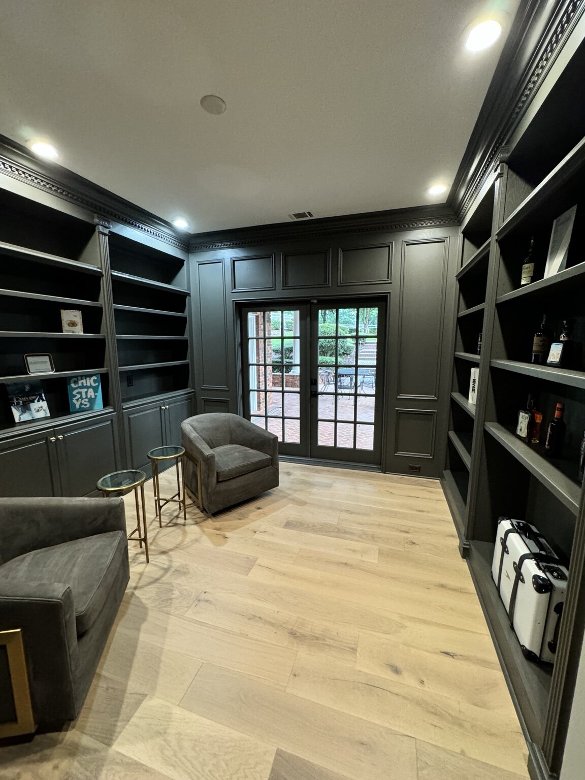 Library after renovation with dark painted joinery and light oak floor