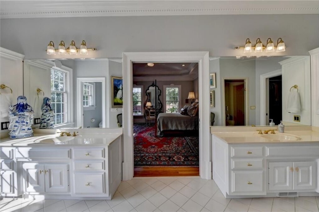 Primary bathroom before renovation, twin vanities