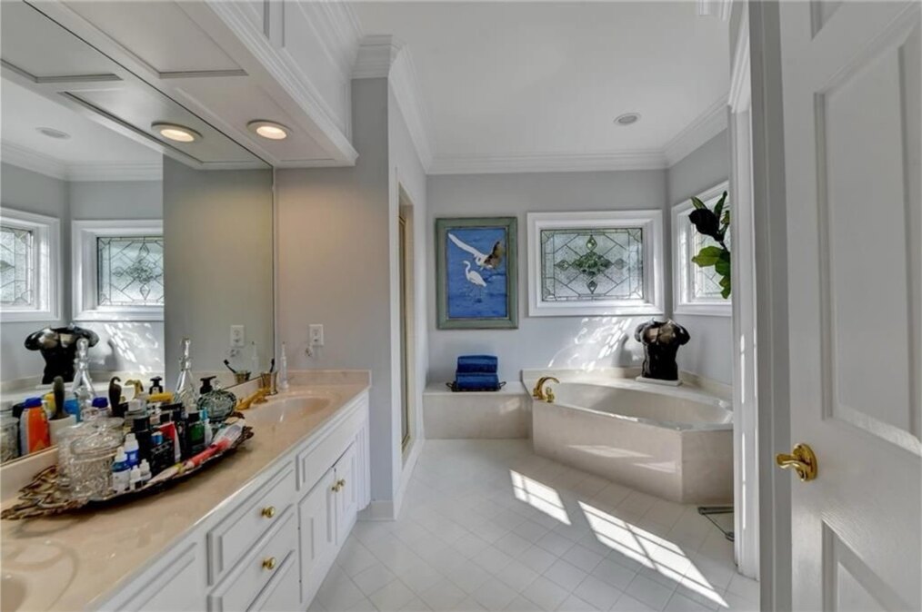 Primary bathroom before renovation, tub and vanity