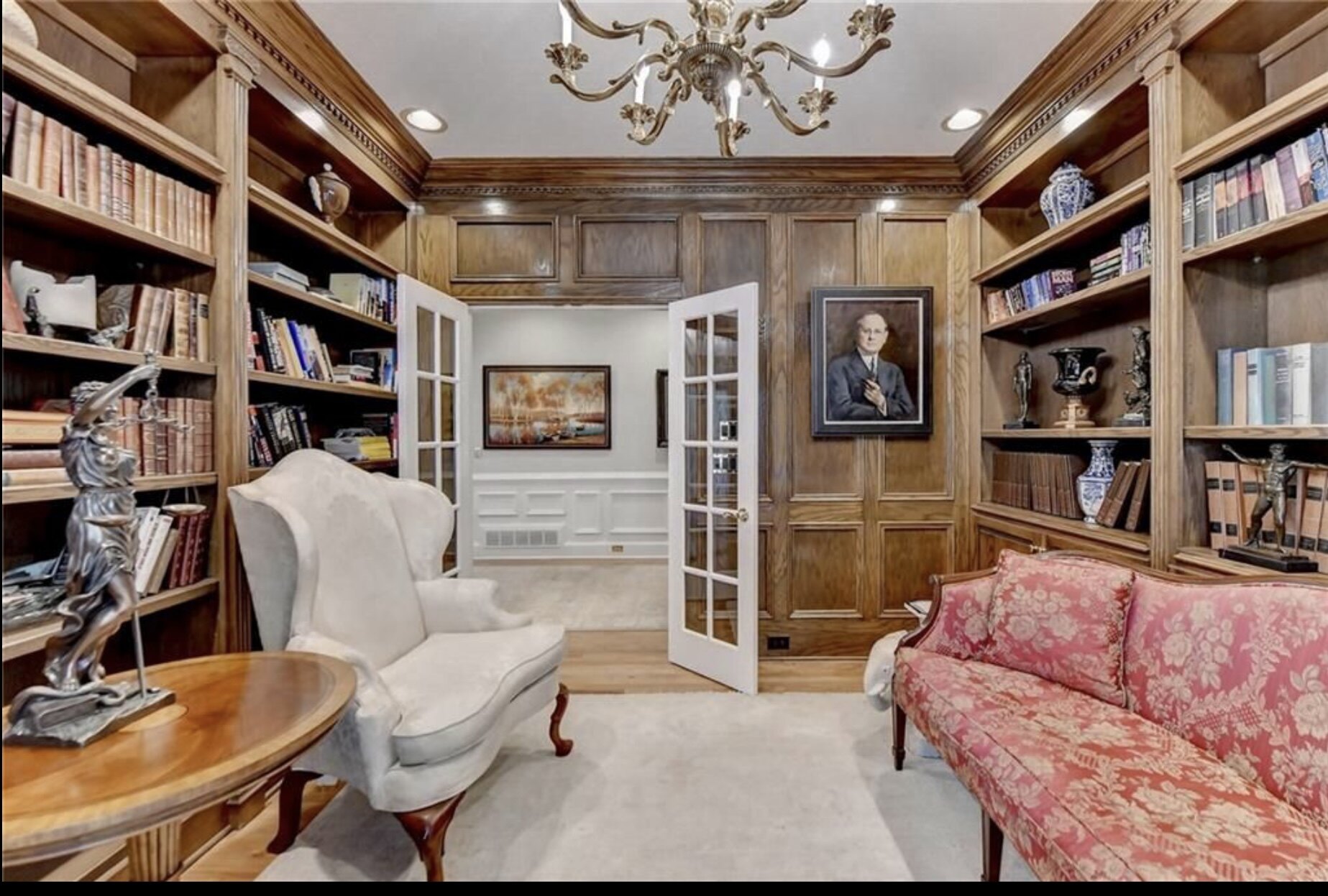 Wood-panelled library before renovation